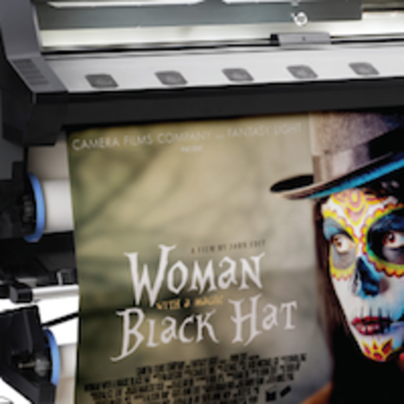 Large format printing machine at Image Zone, producing high-quality banners, posters, and signs with vibrant colors and sharp details.