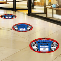 Slip-resistant floor sticker with printed arrows and branding